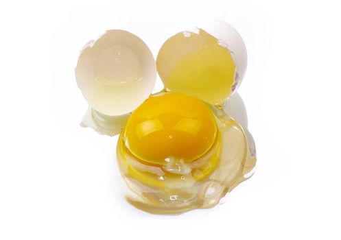 a broken egg on a white background isolated