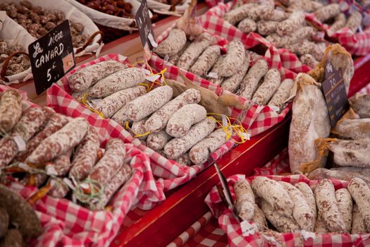 Fine air-dried sausages at market stall.