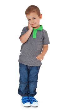 Full length shot of a cute little boy deliberating a decision. All isolated on white background.