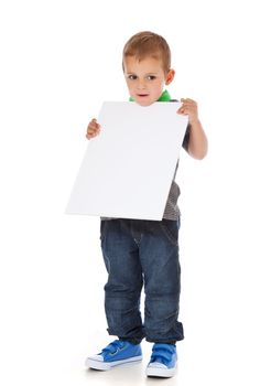 Full length shot of a cute little boy holding a blank white sign. All isolated on white background.