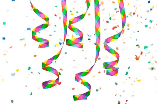 Colorful paper streamer and confetti. All on white background.
