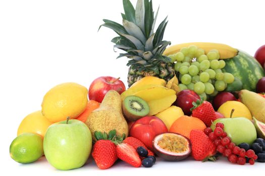 Pile of various fruits. Isolated on white background.