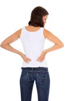 Attractive young woman suffers from back pain. All on white background.