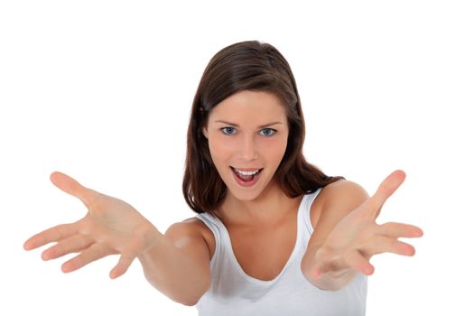 Attractive young woman with welcoming gesture. All on white background.