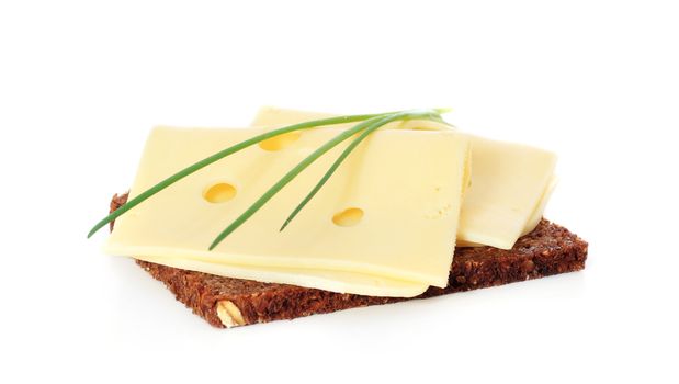 Multi-grain bread with cheese. All on white background.