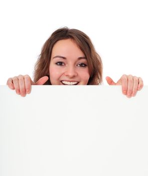 Attractive young woman behind blank white sign. All on white background.