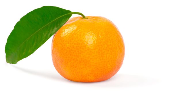 Tangerine with green leaves isolated on white