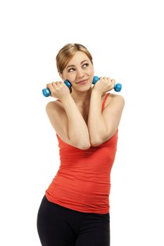 cute fitness woman holding dumbbells to her face on white background