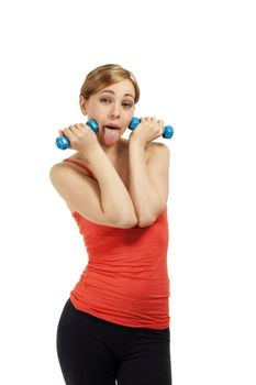 funny young fitness woman with dumbbells on white background