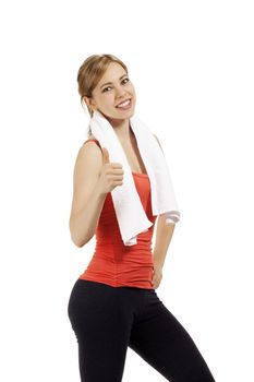 happy young fitness woman with a white towel showing thumb up on white background
