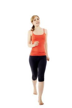 happy young walking fitness woman on white background