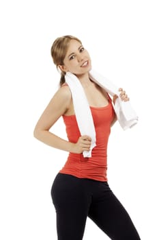 portrait of a happy young fitness woman with a white towel on white background