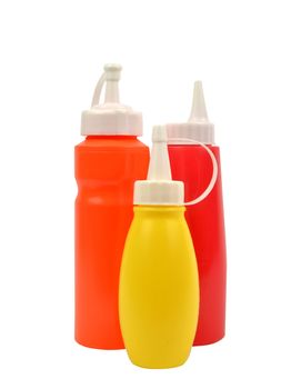 mustard and ketchup squirt bottles isolated on white