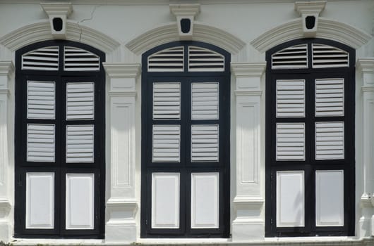 old window in phuket, thailand