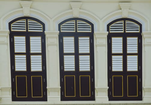 old window in phuket, thailand