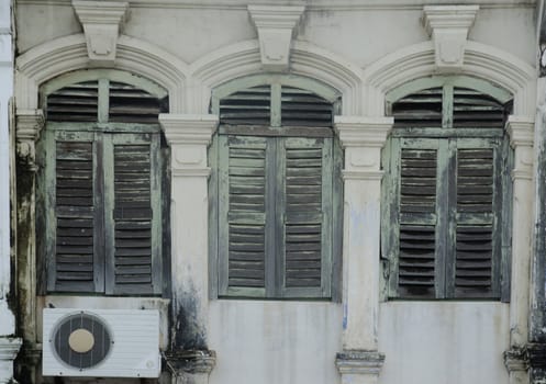 old window in phuket, thailand