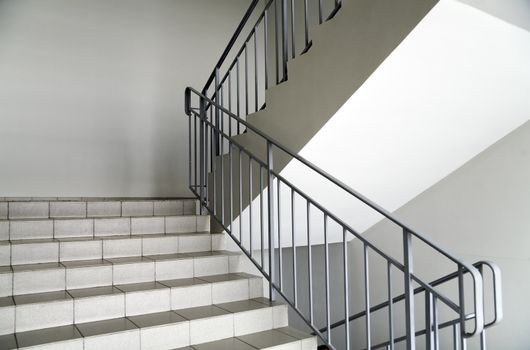 staircase with metallic handrails in modern interior