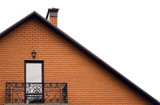 roof and balcony of house from red brick