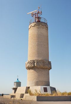 The lighthouse-a monument on a mountain at  the sea