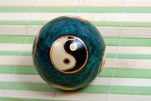 zen ball yin yang for relaxation on bamboo background.