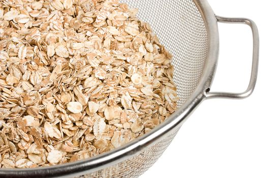 oat in strainer isolated on white background
