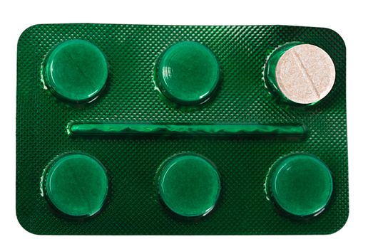Packet of green tablets in a white background