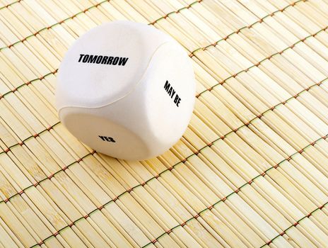 business dice with words on bamboo place mat