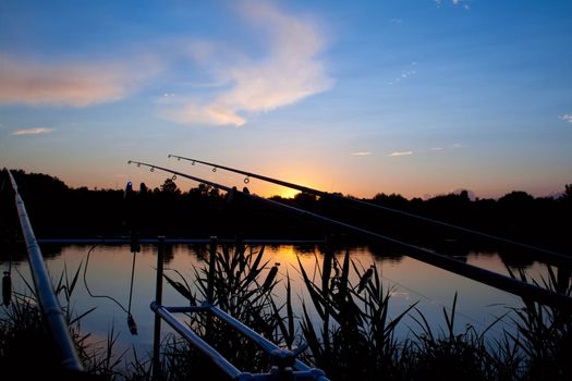 carp fishing sunrise - spinning on rod pod