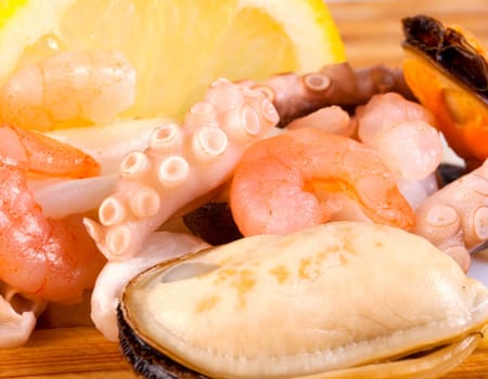 Sea food - closeup boiled prawns ,shrimp and octopus background