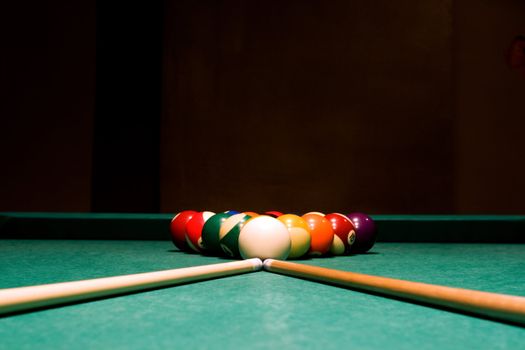 billiard balls and table on black background