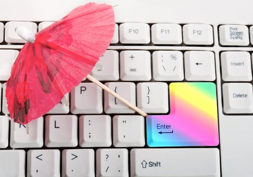 umbrella beach in rainbow rainbow key on a keyboard