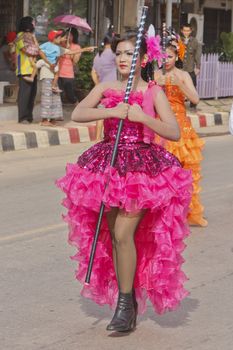 THAILAND - JULY 13: Miss Pirada Suwannarak Drum Major leads holding mace during Dokbual game school parade on July 13, 2012 in Suratthanee, Thailand.