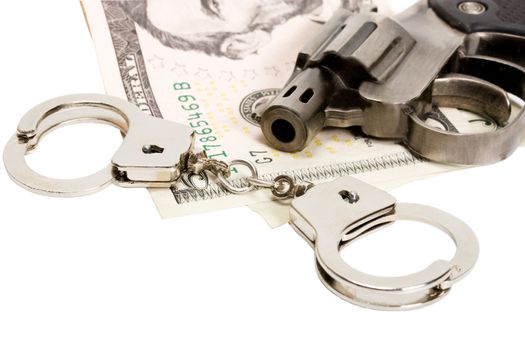 Pistol handcuffs money isolated on white