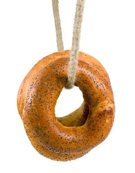 bagel with poppy seeds in rope isolated on white background