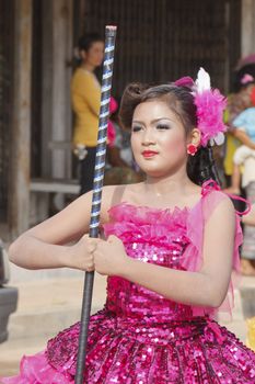 THAILAND - JULY 13: Miss Pirada Suwannarak Drum Major leads holding mace during Dokbual game school parade on July 13, 2012 in Suratthanee, Thailand.