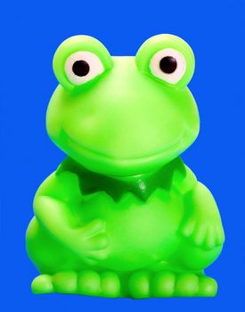 green frog rubber bath toys on blue background