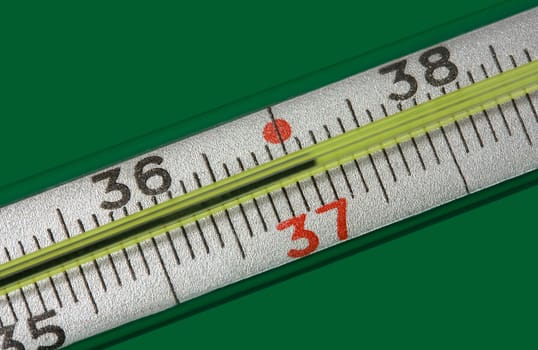 medicine thermometer isolated on green background
