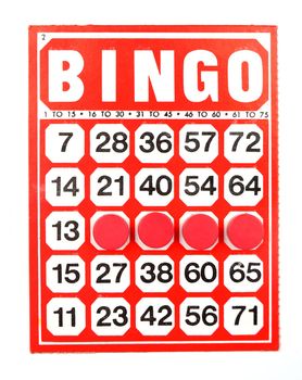 Red bingo card with winning chips 