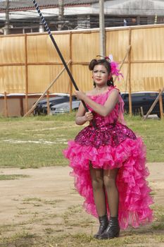 THAILAND - JULY 13: Miss Pirada Suwannarak Drum Major leads holding mace during Dokbual game school parade on July 13, 2012 in Suratthanee, Thailand.