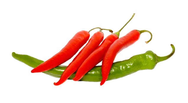 red pepper chile on green pepper isolated on white background.