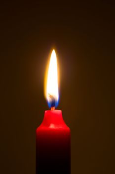 light a candle in the dark background