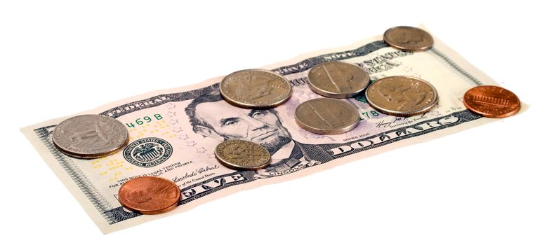 Coins and dollars isolated on white background