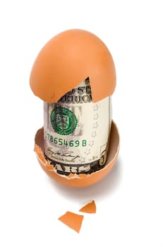 Broken egg with dollar on white background