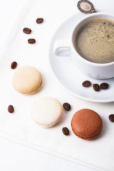 Three colors of macaroons in brown and beige tones