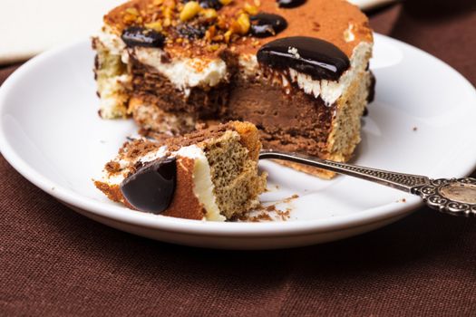 Chocolate cake, close up with the dessert fork