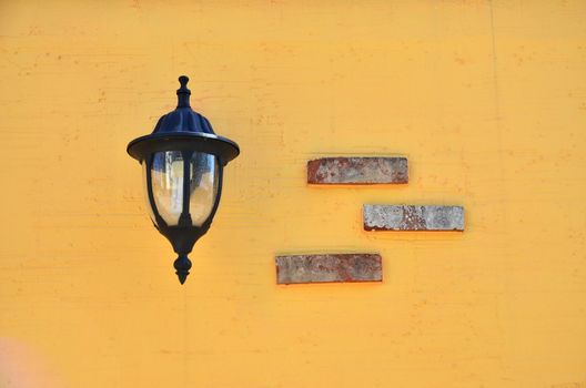lamp on vintage orange wall