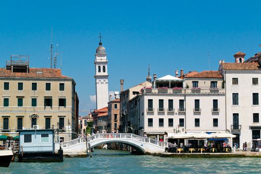 Venice cityscape view with houses and clear sky from water