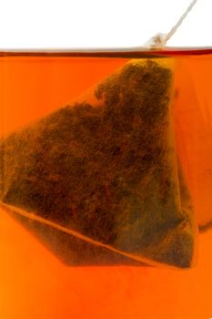 Hot tea with a tea bag filter background.