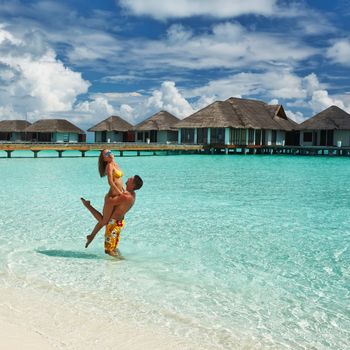 Couple on a tropical beach at Maldives