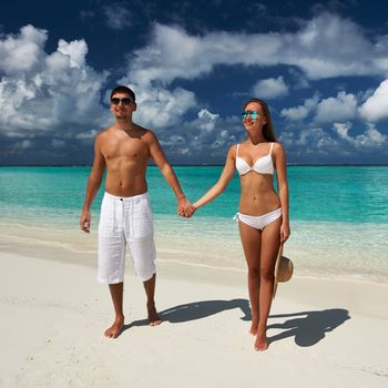 Couple on a tropical beach at Maldives